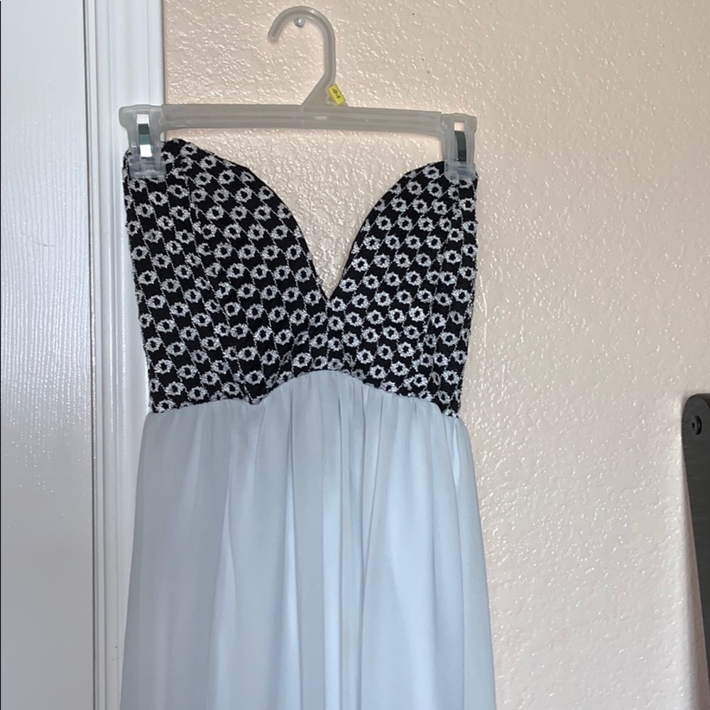 Strapless dress, black top, white bottom.